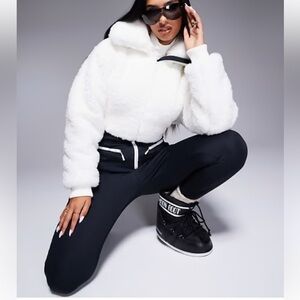 4505 Hourglass Ski suit with faux fur panels and skinny legs in black and white